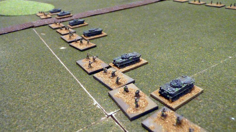 Chinese infantry advance supported by armoured vehciles